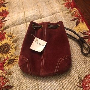 Baby suede Coach drawstring wristlet.